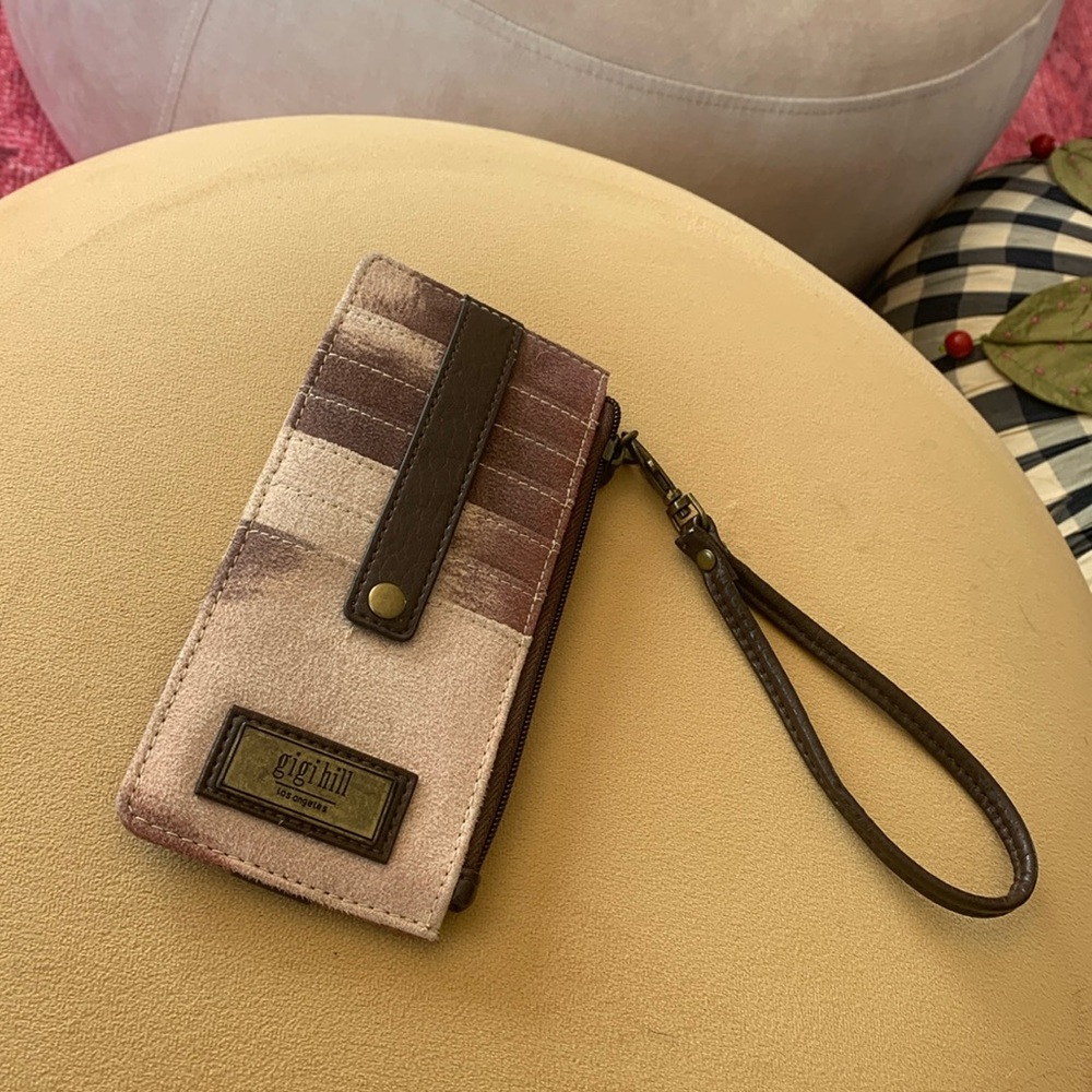 Western style wristlet with removable strap.